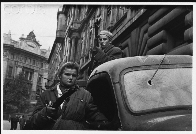 Hungarian Freedom Fighters Standing Armed by a Truck